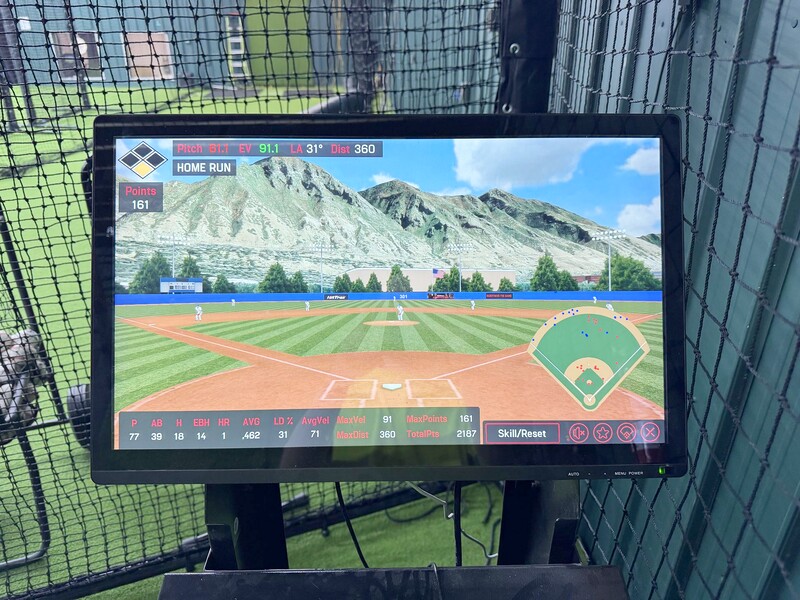 HitTrax screen showing home run with batting stats and stadium view